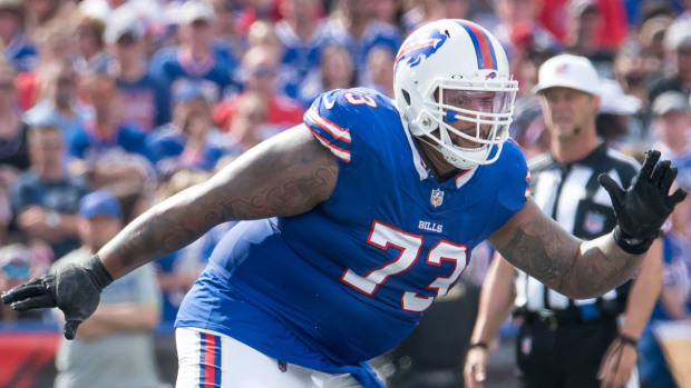 Bills defensive lineman Dion Dawkins blocks during a game.